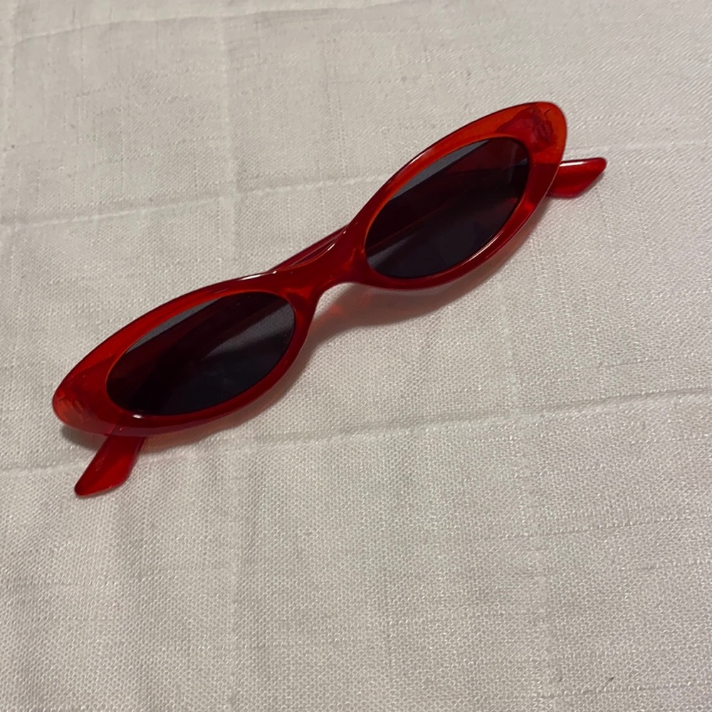 Red oval shaped sunglasses